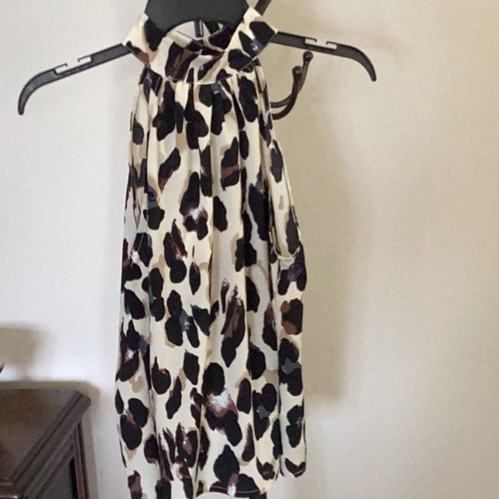 Leopard print sleeveless halter blouse.